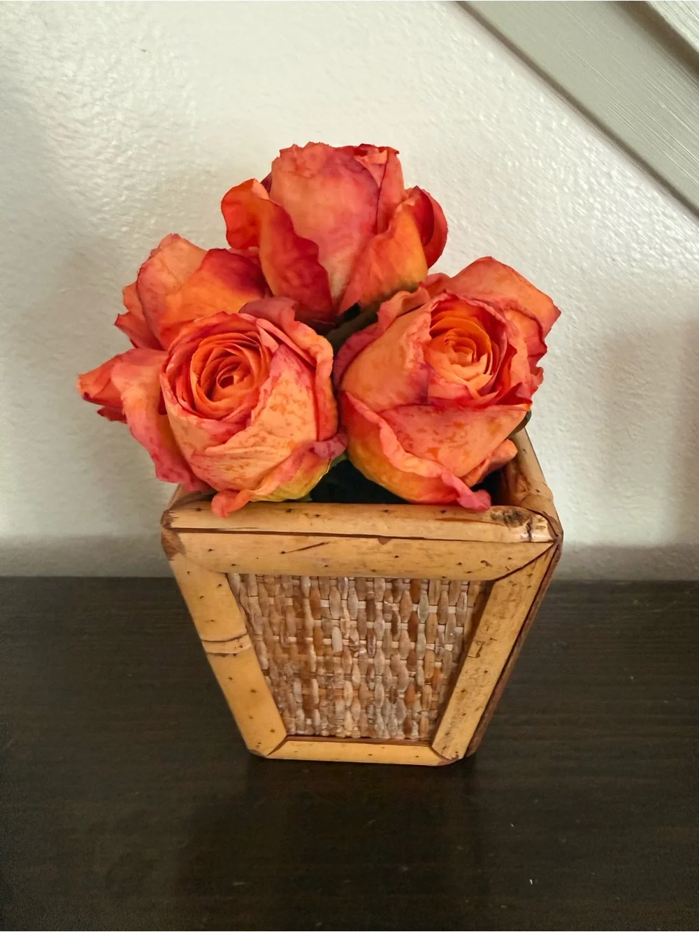 Vibrant Orange Rose Bouquet in Woven Planter